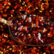 closeup of spoonful of chili crisp